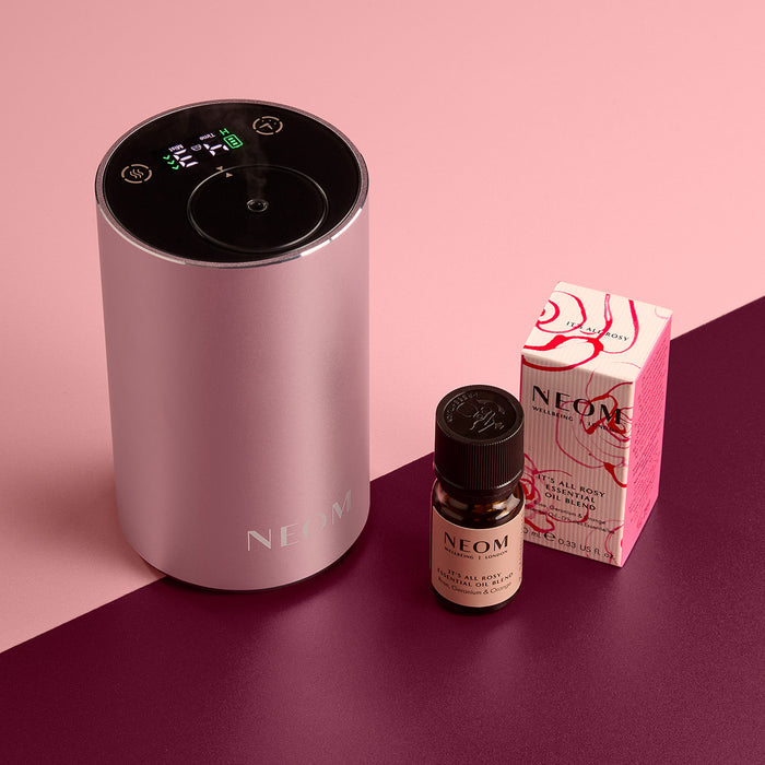 NEOM product on a pink and purple gradient background